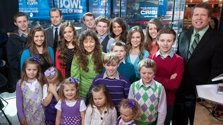 Duggar family posing at TV appearance