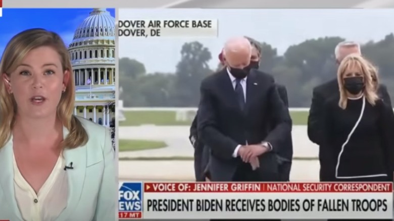 Joe Biden appears to check his watch at Dover Air Force Base