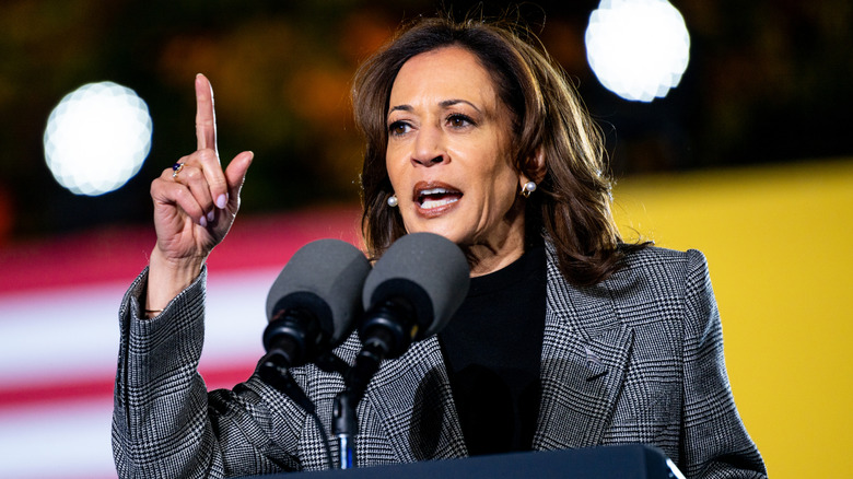 Kamala Harris pointing finger in the air at podium during speech