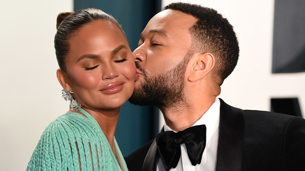 John Legend kissing Chrissy Teigen