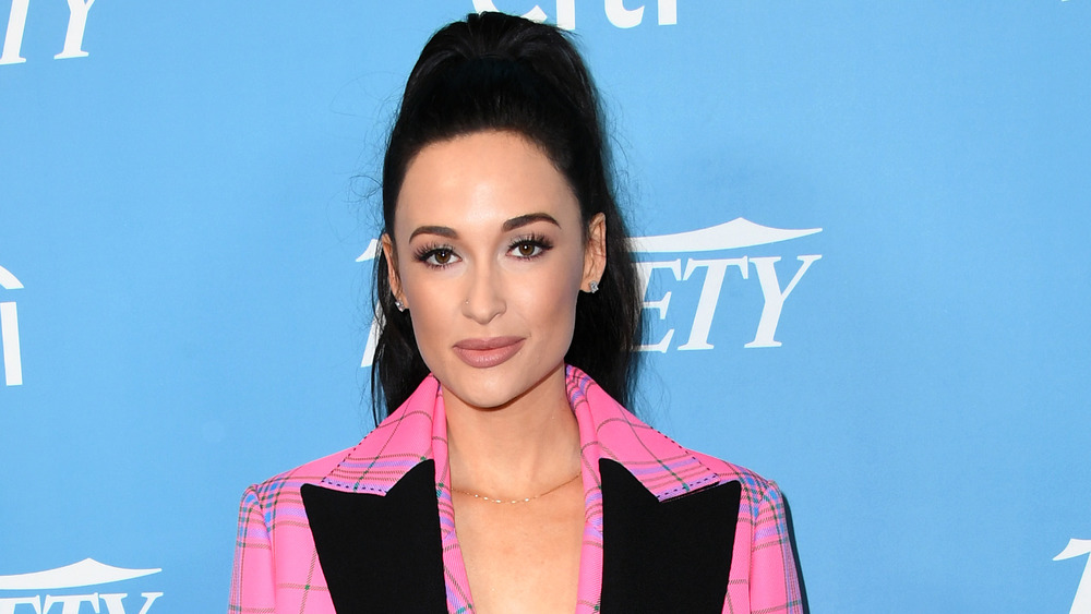 Kacey Musgraves wearing pink checked suit