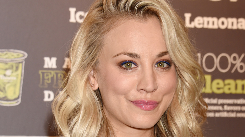 Kaley Cuoco smiles for the camera at an event.