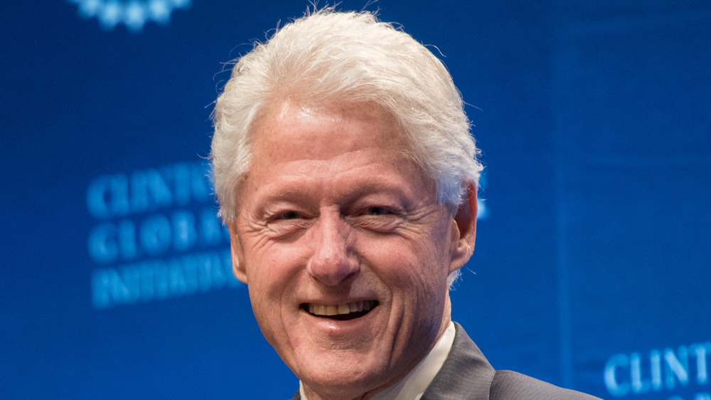 Bill Clinton smiles during an event