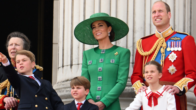 Princess Anne, Prince George, Prince Louis, Kate Middleton, Prince William, and Princess Charlotte stand on balcony