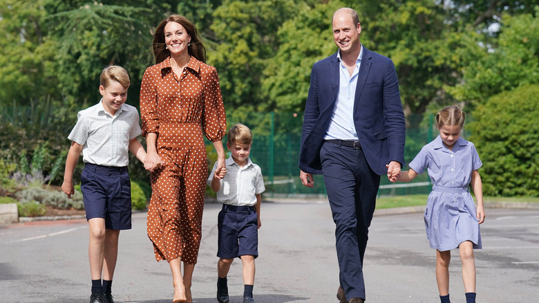 Kate Middleton and Prince William walking with their children