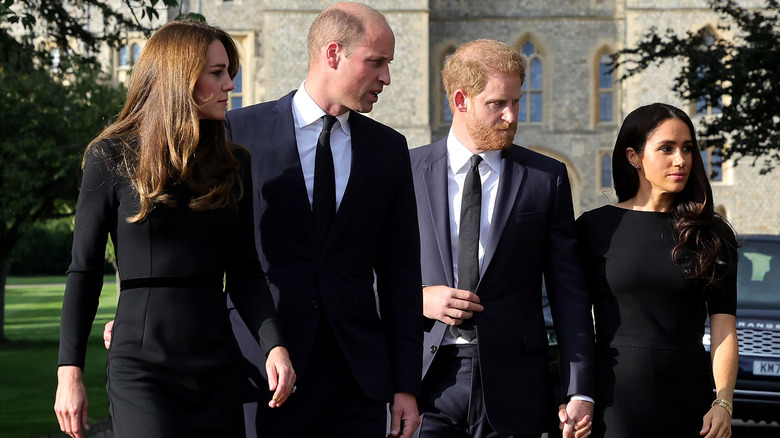 Kate Middleton and Prince William walking with Meghan Markle and Prince Harry