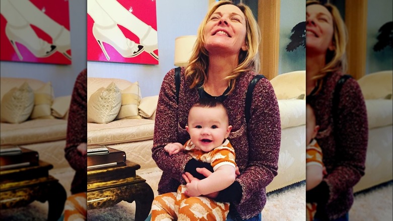 kim cattrall smiling with baby