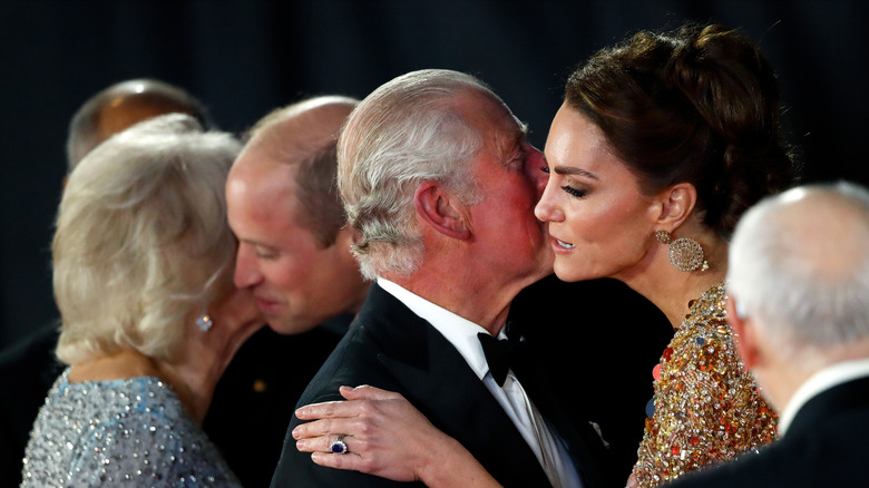 Kate Middleton and King Charles kissing on the cheek