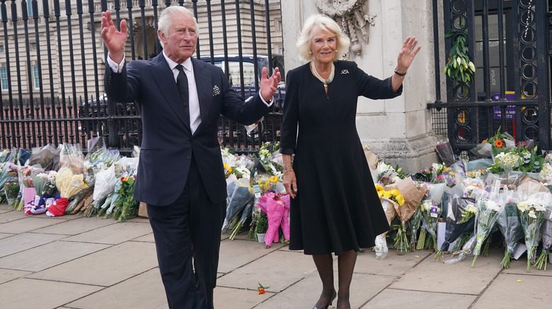 King Charles III and Camilla waving