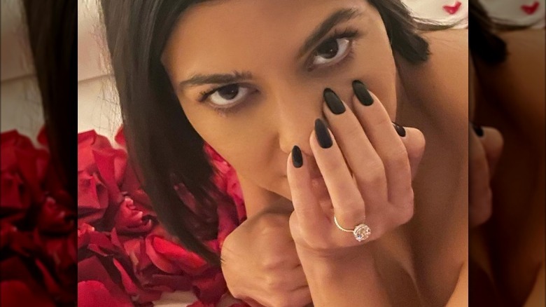 Kourtney Kardashian showing off her engagement ring