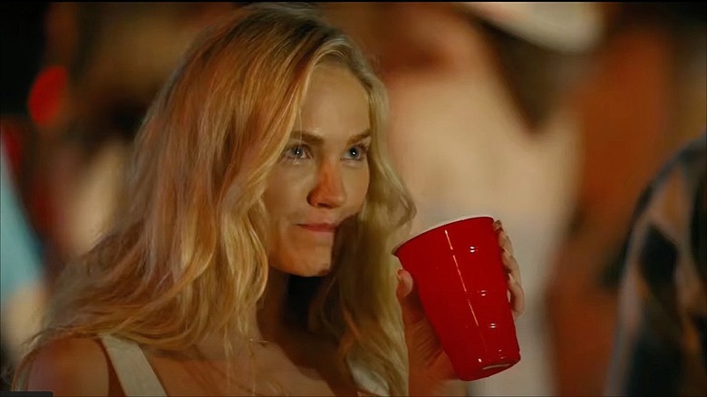 Michelle Randolph with hair down holding red solo cup in "Landman" (2024)