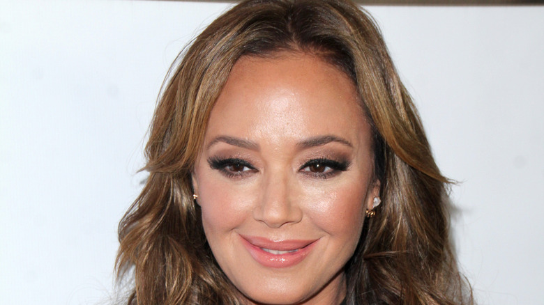 Leah Remini smiling on the red carpet