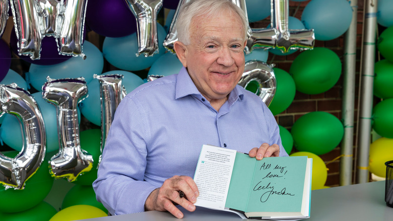 Leslie Jordan with a signed copy of his book