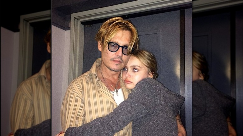 Lily-Rose hugging Johnny Depp