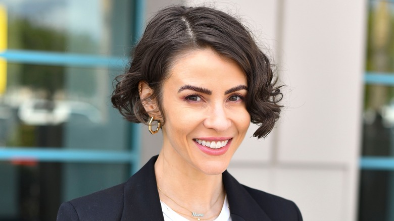 Linsey Godfrey smiles for a photo. 