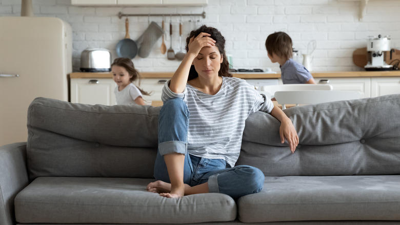 woman on couch, running kids