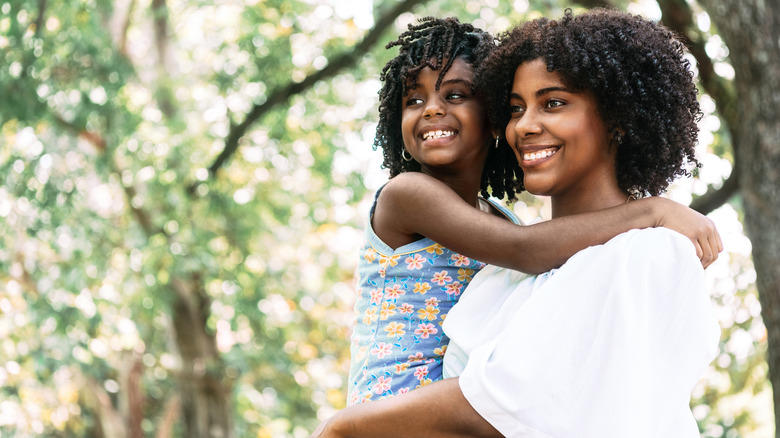 smiling mother and daughter