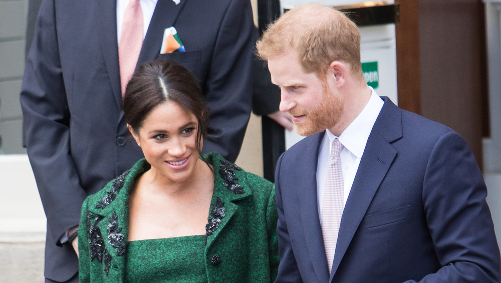 Prince Harry and Meghan Markle walking