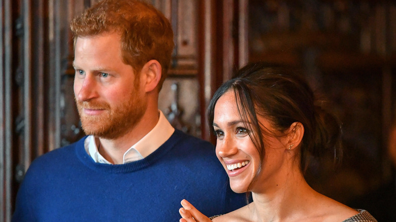 Prince Harry and Meghan Markle smiling