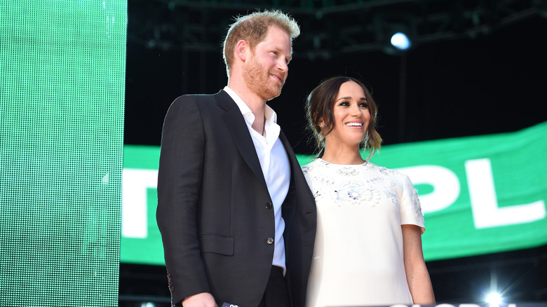 Prince Harry & Meghan Markle smiling