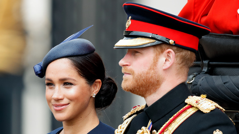 Harry and Meghan  smiling at Trooping the Colour 2019