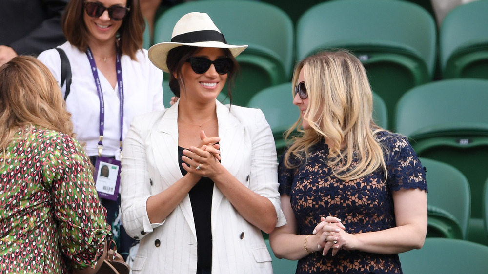 Meghan Markle outdoors in white blazer