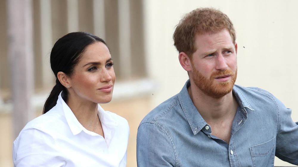 Megha Markle and Prince Harry looking out into the distance