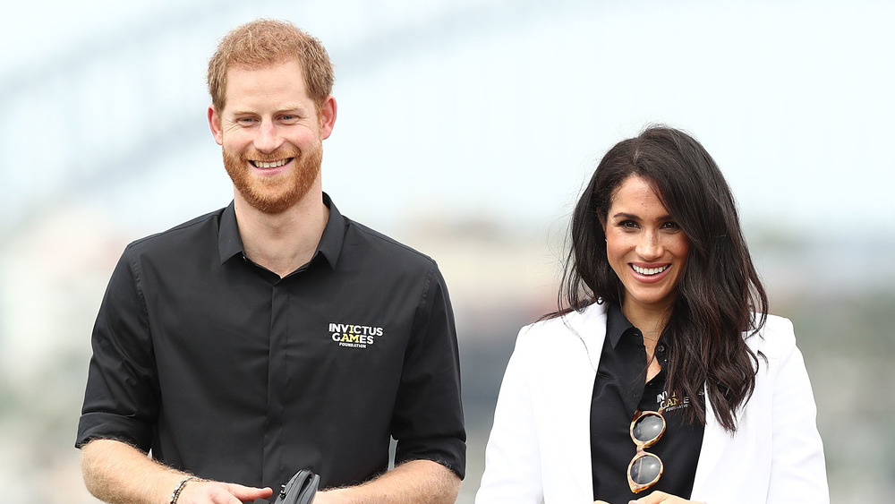 Meghan Markle smiling with Prince Harry