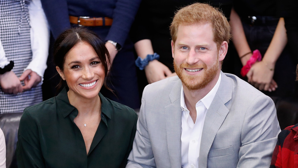 Meghan Markle and Prince Harry arm in arm