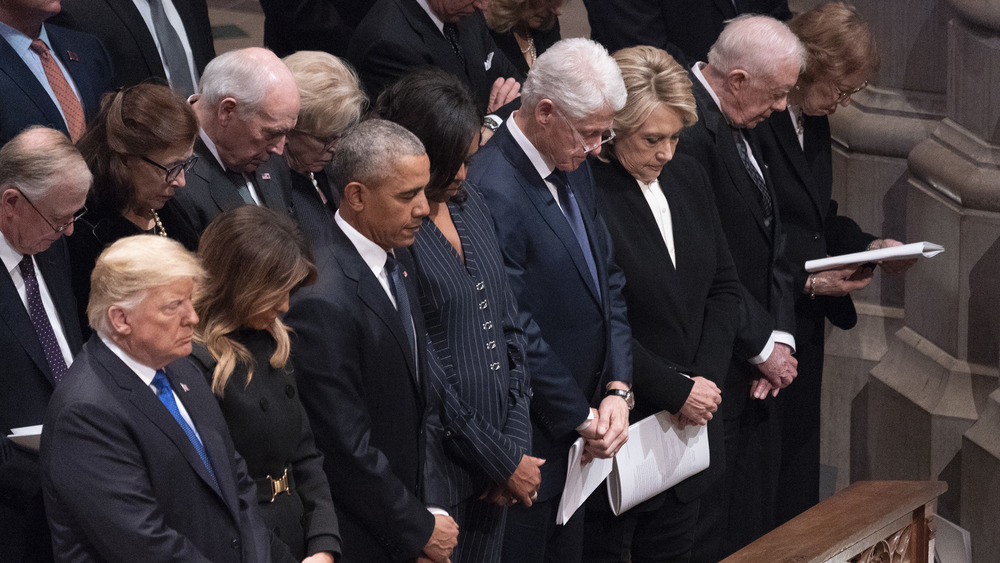 Donald and Melania Trump, Barack and Michelle Obama, and Bill and Hillary Clinton at a service 