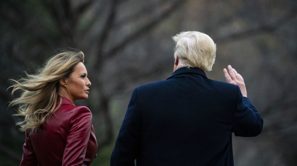 Melania and Donald Trump at White House, walking away