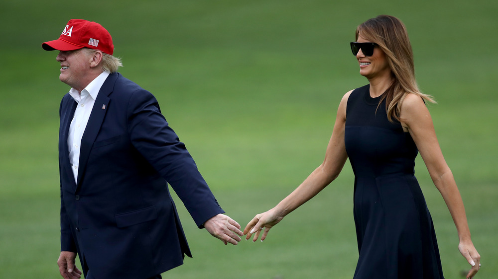 Melania and Donald Trump at a golf course