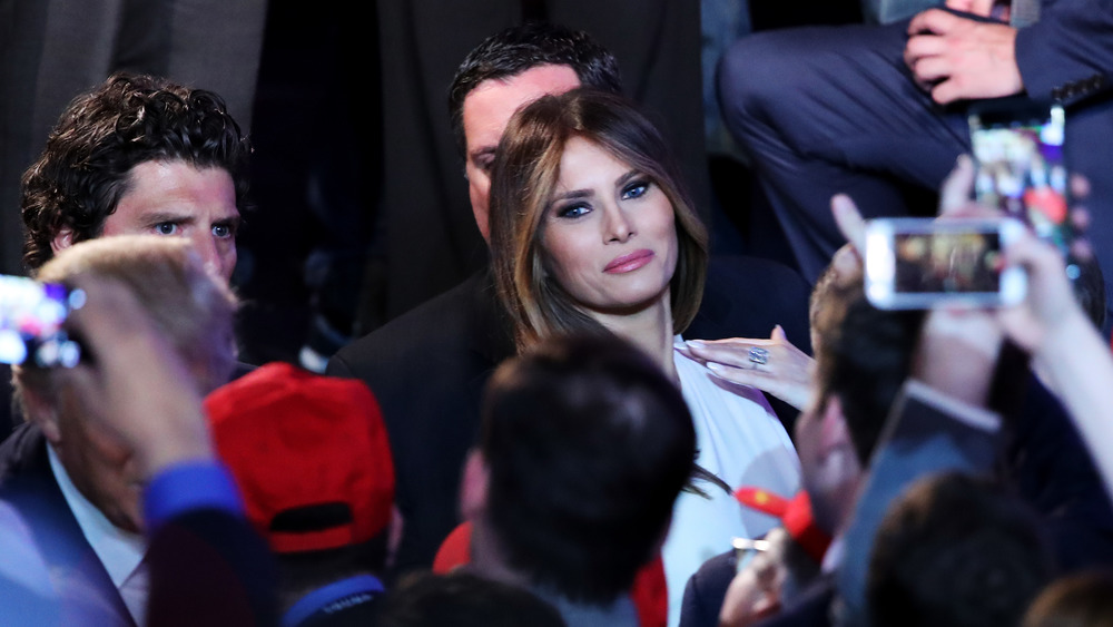 Melania Trump surrounded by the press