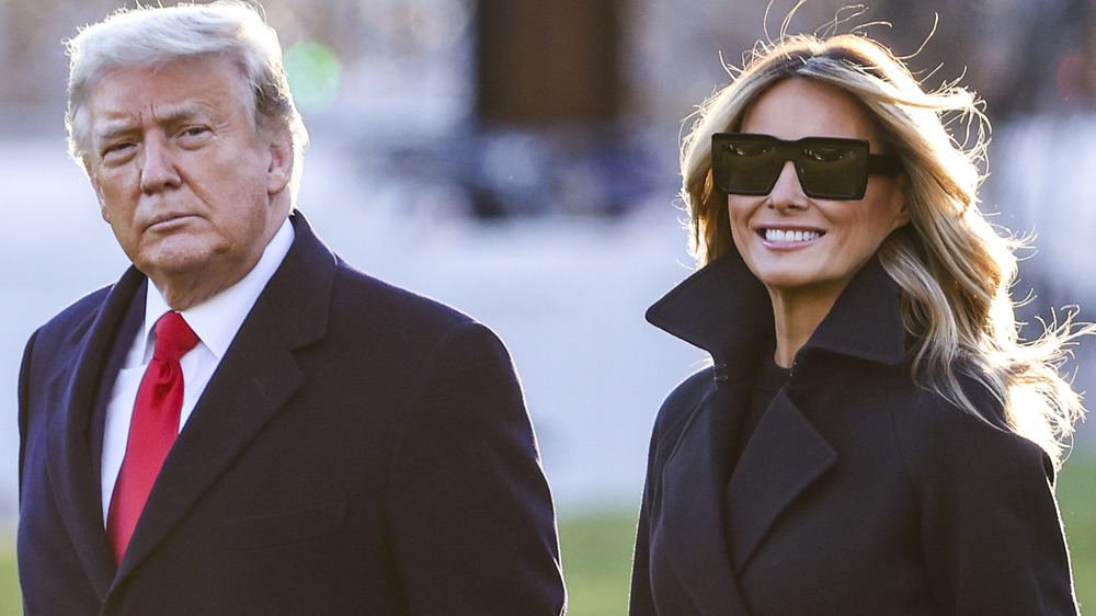 Donald and Melania Trump  walking outside