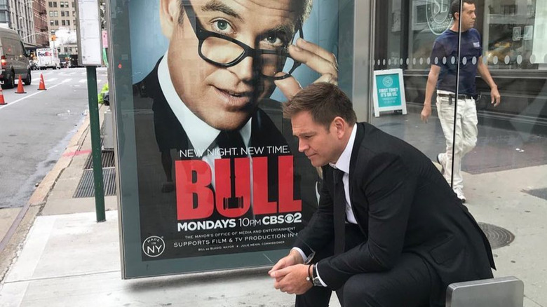 Michael Weatherly in front of poster for bull