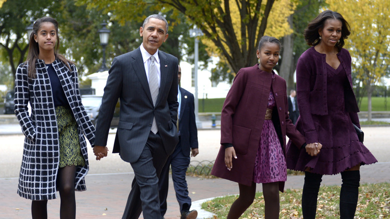 Sasha, Barack, Malia, and Michelle Obama walking