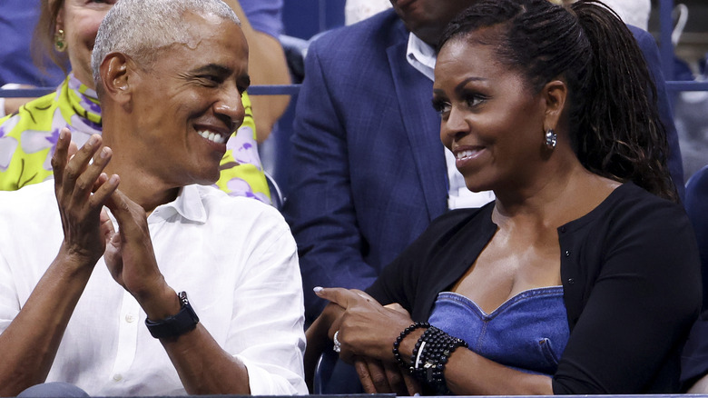 Barack and Michelle Obama smile at each other