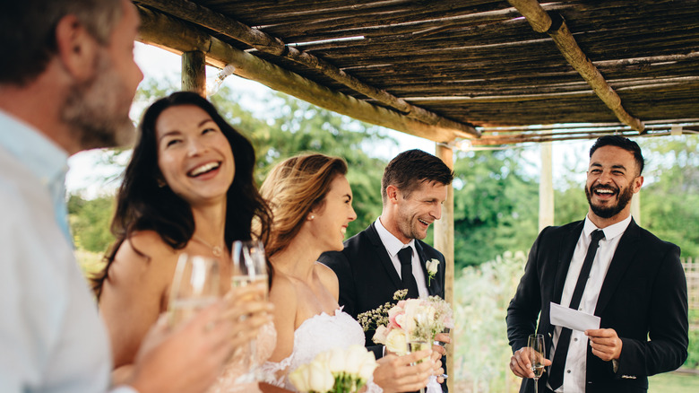 Wedding guests laughing