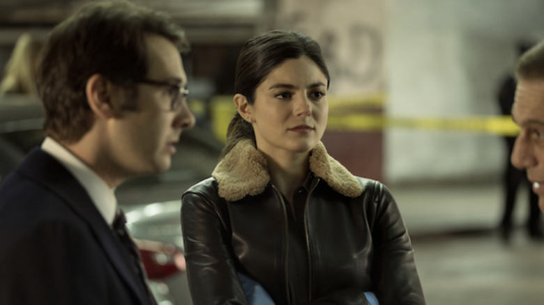 Monica Barbaro in a fur jacket in The Good Cop