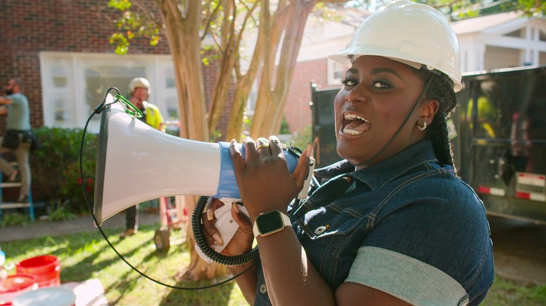 Danielle Brooks speaking into a megaphone on "Instant Dream Home"