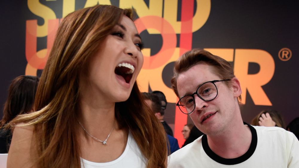 Macaulay Culkin laughing with Brenda Song