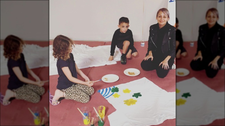 Nicole painting with her kids