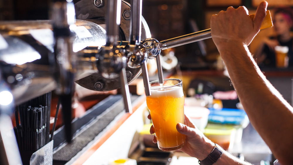 Beer being poured at a bar