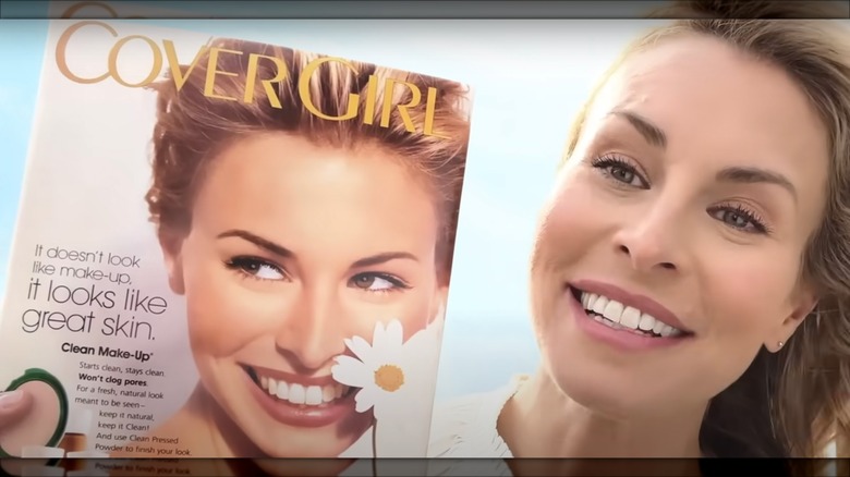 Niki Taylor holding magazine cover of herself