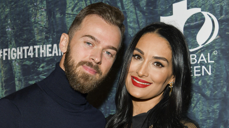 Nikki Bella and Artem Chigvintsev at an event 