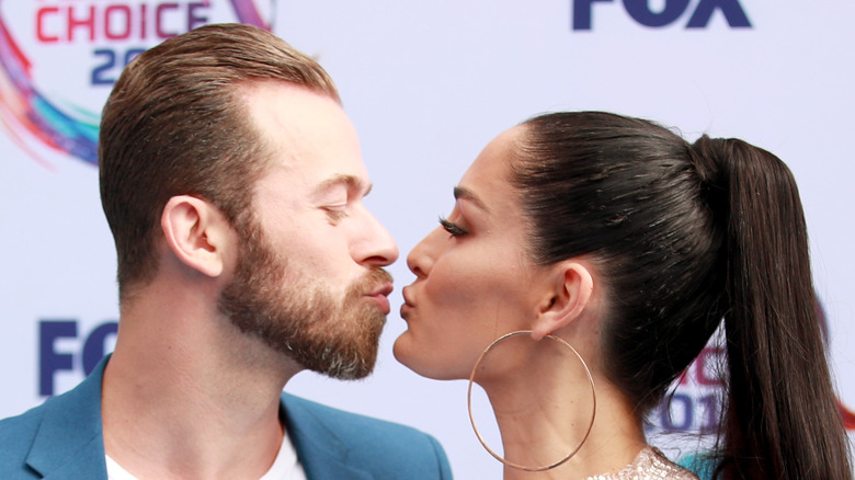 Nikki Bella kisses fiancé Artem Chigvintsev  