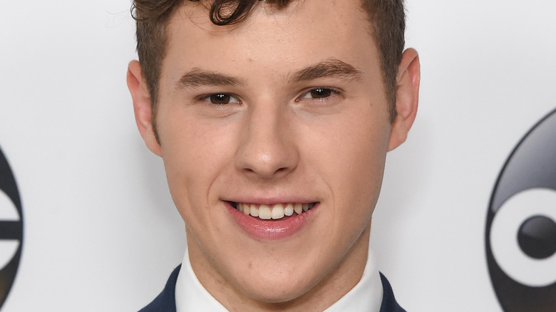 Nolan Gould smiles on the red carpet