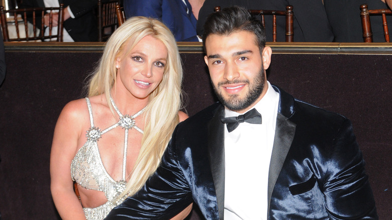 Britney Spears and Sam Asghari smiling at an event