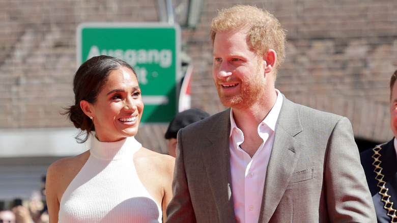 Meghan Markle looks sideways at Prince Harry