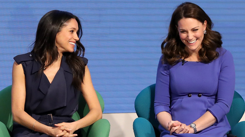 Kate Middleton and Meghan Markle smiling 